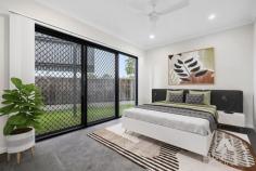  43 Creek Pl Park Ridge QLD 4133 This beautiful, architecturally designed lowset home is situated on an elevated 471m2 block in the prestigious Chambers Chase Estate in Park Ridge. It offers superb kerb appeal in a convenient and family-friendly location. Clean, white architectural lines dominate the aesthetics of this beautiful new build which is luxuriously appointed with premium inclusions throughout. No detail or expense has been spared in the construct of this ex-display home. An open plan dining and living room with high ceilings will graciously welcome you upon entry into this stunning abode, enveloped entirely with windows and sliding doors to fill the abundant space with streams of natural light. This living and dining precinct seamlessly flows out into the covered alfresco space outside that is encircled by lush pockets of landscaping and a beautiful water feature. Back inside, prepare to be captivated by the impressive gourmet kitchen which showcases stunning Caesarstone waterfall kitchen island and benchtops, premium cooking appliances including a 900mm induction cooktop and oven, dishwasher, canopy rangehood, soft-close drawers, an abundance of cupboard storage and an amazing butler's pantry with loads of further storage. A trio of designer pendant lighting finish off this space with pazazz. This stunner presents with 4 spacious bedrooms plus a study. Each bedroom features brand new plush carpets, 3 rooms mirrored bult- in sliding robes, ceiling fans and ducted air conditioning for your comfort. The master suite additionally features a walk-in robe and a designer ensuite showcasing premium ceiling to floor tiles, dual vanities, a large shower and concealed toilet. The main bathroom is equally as stylish and has the addition of an eye-catching stand-alone bathtub and premium fixtures for added luxury. Chambers Chase is a boutique estate and is perfectly designed for family living. Strategically located in one of Queensland's biggest growth corridors and located half-way between Brisbane and the Gold Coast and within close proximity to schools, shops, restaurants, medical facilities and access to major arterials, you will surely bask in everything this property has to offer. It is prime and ready for your inspection now. Property features and inclusions: - Situated on an elevated 471m2 - Built in 2022 - Ex-display home offering premium fixtures and finishes - 4 bedrooms, 3 with BIR, aircon and fans - Master features WIR and stunning designer ensuite - Spacious, open plan living and dining with scissor truss ceiling - Striking gourmet kitchen which features: - Expansive Caesarstone waterfall island benchtop - Premium 900mm induction cooktop and oven - Soft-close drawers - An impressive Butler's pantry with sink and storage - Large laundry space with an abundance of storage - High ceilings - Premium window coverings and blinds - LED downlights throughout - Premium porcelain tiles in living, kitchen and wet areas - Brand new plush carpets in bedrooms and study - Ducted air conditioning throughout, including in garage - Wide street frontage with unique feature wall for privacy - Large, covered and tiled alfresco space - Beautiful, tiled water feature to alfresco area - Lush, low maintenance landscaping - Rendered fencing with established trees for ultimate privacy - Double remote garage, with carpet and ducted aircon - NBN - Council rates $900/qtr in water 