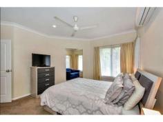  11 Excelsa Court Rosebery NT 0832 $590,000 Spacious family living will impress in this large ground-level home that's set on a huge 932sqm block backing onto beautiful parkland at rear. Two living areas plus a separate dining area join four generous bedrooms and a private office/study or parents' retreat. Entertainers will also love the park-view alfresco patio with in-ground spa. The home is also ideally located in a family-friendly setting close to schools, childcare facilities and shops. Spacious living room at front connects to the separate dining area Additional open-plan family/meals area opens onto park-view patio Huge central kitchen features stone bench tops and premium cabinetry Large master bedroom with corner walk-in robe and modern ensuite Study, parents' retreat, gym or nursery off the master bedroom Built-in robes to good-sized second, third and fourth bedrooms Spotless family-sized main bathroom with separate bath and shower Well-equipped internal laundry with separate toilet and outdoor access In-ground spa, shed and manicured lawn and gardens to backyard Integrated double carport plus extra parking on paved driveway at front This quality family residence is superbly presented throughout and awaits your personal touch to create your forever home. Enter into the large front porch and into the formal living area that is well presented in neutral contemporary tones. Continue through to the separate dining area that flows through to another open-plan family/meals area with access onto the lovely park-view patio. The huge central kitchen is the heart of the home and will easily cater for the growing family with abundant bench and cupboard space and quality appliances. The master bedroom is privately located off the formal living area at the front of the home, and features a walk-in robe, ensuite and an adjoining study that's ideal for use as a sitting room/library, gym, yoga studio or nursery. Three more bedrooms - all with built-in robes - are set off the family area at rear, and the main bathroom plus separate laundry complete the interior floor plan. Outside, there is an in-ground spa to the patio, and the beautifully landscaped backyard adjoins stunning parkland at rear. 