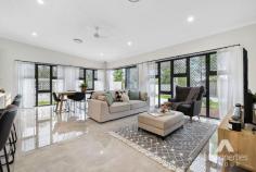 43 Creek Pl Park Ridge QLD 4133 This beautiful, architecturally designed lowset home is situated on an elevated 471m2 block in the prestigious Chambers Chase Estate in Park Ridge. It offers superb kerb appeal in a convenient and family-friendly location. Clean, white architectural lines dominate the aesthetics of this beautiful new build which is luxuriously appointed with premium inclusions throughout. No detail or expense has been spared in the construct of this ex-display home. An open plan dining and living room with high ceilings will graciously welcome you upon entry into this stunning abode, enveloped entirely with windows and sliding doors to fill the abundant space with streams of natural light. This living and dining precinct seamlessly flows out into the covered alfresco space outside that is encircled by lush pockets of landscaping and a beautiful water feature. Back inside, prepare to be captivated by the impressive gourmet kitchen which showcases stunning Caesarstone waterfall kitchen island and benchtops, premium cooking appliances including a 900mm induction cooktop and oven, dishwasher, canopy rangehood, soft-close drawers, an abundance of cupboard storage and an amazing butler's pantry with loads of further storage. A trio of designer pendant lighting finish off this space with pazazz. This stunner presents with 4 spacious bedrooms plus a study. Each bedroom features brand new plush carpets, 3 rooms mirrored bult- in sliding robes, ceiling fans and ducted air conditioning for your comfort. The master suite additionally features a walk-in robe and a designer ensuite showcasing premium ceiling to floor tiles, dual vanities, a large shower and concealed toilet. The main bathroom is equally as stylish and has the addition of an eye-catching stand-alone bathtub and premium fixtures for added luxury. Chambers Chase is a boutique estate and is perfectly designed for family living. Strategically located in one of Queensland's biggest growth corridors and located half-way between Brisbane and the Gold Coast and within close proximity to schools, shops, restaurants, medical facilities and access to major arterials, you will surely bask in everything this property has to offer. It is prime and ready for your inspection now. Property features and inclusions: - Situated on an elevated 471m2 - Built in 2022 - Ex-display home offering premium fixtures and finishes - 4 bedrooms, 3 with BIR, aircon and fans - Master features WIR and stunning designer ensuite - Spacious, open plan living and dining with scissor truss ceiling - Striking gourmet kitchen which features: - Expansive Caesarstone waterfall island benchtop - Premium 900mm induction cooktop and oven - Soft-close drawers - An impressive Butler's pantry with sink and storage - Large laundry space with an abundance of storage - High ceilings - Premium window coverings and blinds - LED downlights throughout - Premium porcelain tiles in living, kitchen and wet areas - Brand new plush carpets in bedrooms and study - Ducted air conditioning throughout, including in garage - Wide street frontage with unique feature wall for privacy - Large, covered and tiled alfresco space - Beautiful, tiled water feature to alfresco area - Lush, low maintenance landscaping - Rendered fencing with established trees for ultimate privacy - Double remote garage, with carpet and ducted aircon - NBN - Council rates $900/qtr in water 