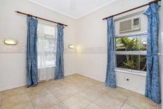  32 Wulagi Crescent Wulagi NT 0812 $475,000 This popular Barclay-style home will delight with a charming wrap-around verandah plus a covered entertainer's patio and in-ground spa in a private garden setting. Generous living and dining areas join an updated kitchen, and three good-sized bedrooms will easily accommodate the young family. You'll also love this convenient location that's walking distance to Wulagi Primary School and Sanderson Middle School, and just five minutes to Casuarina Square. Large living room and adjoining dining area with access to patio Updated kitchen with electric cooking and servery window/bar Huge wrap-around verandah provides ample alfresco living space Well-presented original main bathroom with bath and shower Built-in robes to good-sized master, second and third bedrooms Well-equipped internal laundry with storage and verandah access 3m x 2.8m garden shed/workshop at rear with semi-enclosed annex Fenced in-ground spa under pergola; large rear lawn in backyard Lush, established perimeter gardens create excellent privacy Long front carport provides covered parking for three cars Low-maintenance ground-level living is a breeze in this well-presented three-bedroom home that's ideal for the active family with a large backyard and plenty of covered alfresco living and entertaining space. This charming ground-level home is set well back from the street with lush, established front gardens and a driveway connecting into the long side carport that can accommodate up to three cars. Enter via the front verandah and into the main living room that flows through to a separate dining area with access to the covered patio and fenced in-ground spa. The separate kitchen has been updated with new cabinetry, and features a servery window and bar into the dining area. A hallway off the entry/living space connects to the three bedrooms, main bathroom and separate laundry. There are built-in robes to all three bedrooms; the original main bathroom features a separate bath and laundry; there is a built-in linen cupboard to the hallway; and the internal laundry opens to the rear verandah. The home is tiled throughout for fresh modern living, and air conditioning units to the living room and all three bedrooms. 