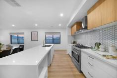  2 Corandirk St Mambourin VIC 3024 $700,000 - $745,000 Instantly inviting and surprisingly spacious, this family-friendly entertainer offers so much more than initially meets. Generous open plan design complimented by gleaming brand new fittings and fixtures from floor to ceiling. The stunning master bedroom offers an exclusive en-suite bathroom with dual vanities, shower and walk-in robes, while the remaining generous size bedrooms are all fitted with built in robes and serviced by the quality main bathroom. Beyond a welcoming entrance hallway, you will discover a front lounge area followed by spacious open-plan living and dining area alongside a gorgeous and massive kitchen equipped with high-quality, stainless-steel appliances, a spacious walk in pantry, 40mm waterfall stone bench island, plenty of cupboard space, soft closing cabinets, and much more. Other quality features include… – Spacious formal and informal living zones – Superbly presented functional kitchen fitted with 900mm stainless steel Appliances and plentiful cupboard space combined with spacious meal area – High ceiling throughout – Ducted Heating and Evaporative cooling – LED Downlights – Security camera with CCTV monitoring and alarm system – Stone benches throughout including launderette – Garage with internal access and additional storage Be quick to make your dream a reality with this great home located in an unbeatable location. 
