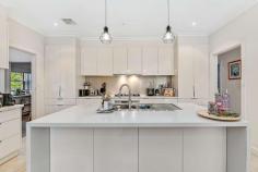  94 Radnor Street Camberwell VIC 3124 With space galore, this six-bedroom family stunner is ideal for a growing or multi-generational family seeking plenty of space and loads of creature comforts. Set over two levels on a 723 m² block, it offers gorgeous street appeal and a location that's hard to beat. With multiple living areas, there's plenty of room for everyone to have their own space as well as come together as a family. Downstairs, you'll enjoy high ceilings and a large formal lounge with a gas fireplace as well as a formal dining room for formal family meals or hosting dinner parties. They flow into an open kitchen, living and meals area where you can whip up family favourites in the well-appointed kitchen. It's inclusive of an island-style bench with luxury stone benchtops, glass splashbacks, a gas cooktop and oven and a dishwasher. Love your morning cuppa? A coffee bar is also included. A separate rumpus room is ideal for a games room or teen retreat. Dine in or step outside to a beautifully landscaped private rear garden with a sprinkler system, a garden shed for outdoor storage and a double garage for off-street parking. A beautifully landscaped and low-maintenance rear yard offers space for soaking up sunshine or entertaining. The deluxe upstairs master bedroom includes a walk-in robe as well as access to a private ensuite while the remaining bedrooms include built-in robes. Also upstairs, a dual-access bathroom/ ensuite connects two of the bathrooms for added convenience. A bonus upstairs retreat with a bonus kitchenette is convenient for hosting guests or serving as a teen retreat. Added perks include NBN connectivity for work or play, a butler's laundry, ducted heating, evaporative cooling, halogen downlighting and decorative pendant lighting, a luxury downstairs spa bath and more. You'll be located within close proximity to Camberwell Road shops and cafes, Bowen Gardens, Leo's Supermarket, Gardiners Creek Reserve, trams, Camberwell South Primary School and Camberwell Junction. Property Specifications: Spectacular six-bedroom, three-bathroom family home with several living areas Beautifully presented and well-maintained Private landscaped rear garden with shed, sprinkler system Well located near Camberwell shops, cafes, schools, transport and more 