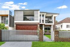  35 Worland Street Yagoona NSW 2199 $1,749,950 Buying the perfect family home vs. building the perfect family home is always a household discussion. This near new residence makes that decision a lot easier. Here is your opportunity to buy a home that has been built and designed for the growing family, which has been finished to the highest of standards. This immaculate residence offers spacious interiors, maximising natural light whilst offering a functional floor plan perfect for large families. Ground level offers: Guest bedroom with built-in wardrobe, positioned close to the main bathroom downstairs Spacious formal and informal living/dining areas seamlessly flowing to the outdoor alfresco area Stunning kitchen with gas cooking, quality appliances, 40mm stone bench tops and breakfast bar Modern main bathroom Separate laundry with additional bathroom, kitchenette and external access Two alfresco areas Double lock-up garage and additional off-street parking in the driveway Level 1 offers: Five bedrooms, two with en-suites, four with built in wardrobes Massive master bedroom offers walk-in wardrobe, desk space, private balcony and modern en-suite Modern main bathroom with tub Living area/office space Property features include: Elegant granite staircase with frameless glass balustrade Large 450 x 900 porcelain tiles downstairs and floating timber flooring upstairs Ducted air conditioning, surveillance camera and alarm/intercom system Ducted vacuum Double brick construction with concrete slab Level grassed backyard with manicured gardens at the front and rear Double automatic garage with internal access Automatic front gate Natural gas outlets All this is located within close proximity to local schools, parks, shops and less than an 8 min (500m) walk to Yagoona Station. Also walking distance to Birrong Station and shops. We highly recommend you come out to inspect to really appreciate what this luxury home has to offer. 