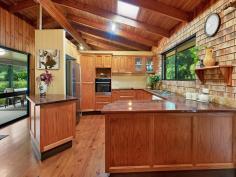  269 WITTA ROAD WITTA QLD 4552 Combining 11 acres of 'Land for Wildlife', walking tracks, creek, remnant rainforest, open grazing land and a rambling brick home, this property meets the brief for privacy, tranquillity and nature while also bringing out the future buyer's creative spark. The land area on offer has a mix of native vegetation, fruit trees, avocados, macadamias and veggie beds on all near level with only gentle slopes down to the creek. Enjoy the sounds from an array of birdlife and expect regular visits from wallabies. Well established walking tracks will take you on a circuit of the property and provide easy access for nature watching and maintenance. If some cattle or a horse or two are on the wish list, then this is amply taken care of with the separate fenced paddock to the rear of the property. Easy road access is a plus with Berganns Lane running down one full boundary. • Four generously proportioned bedrooms all on one level • Main bathroom with separate WC • Separate office with potential to be converted into en suite • Large deck looking onto palms and stunning forest trees • Open plan lounge / dining and kitchen with cathedral ceilings • Well-appointed large kitchen • Wood burning stove plus reverse cycle A/C • Laundry/utility with second WC on lower level with internal access and separate entry • Oversized carport or covered alfresco next to the home • 12m x 6m shed with power • Creek and separate paddock One of the outstanding aspects of this property is the gentle nature of the land. The parcel around the residence is near level, while the separate paddock and creek are all easily accessed and very user friendly. The property has an abundance of water with 30,000 litres collected from the home and a bore. This property offers a peaceful and private retreat with room to grow and put your own stamp on the place over time. Whether you're looking for a wildlife refuge, self-sustaining lifestyle with a couple of animals or a combination of both, this property must be at the top of your list. 