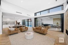  18 Scott Street Dulwich SA 5065 $3,990,000 A project two years’ in the making and worth the wait in every way, what was a weary C1900 character villa is today nothing short of a brand new two-level family home that gets more searingly stylish with every step towards its magnificent open-plan, crowd-pleasing crescendo. Stripped right back to its bare bones; not a stone was unturned, nor was an expense spared, recasting and architecturally extending this 6-star-energy-rated 6-bedroom home that will charge your electric cars in 18 minutes and make summers a dream. You aren’t dreaming. Every inch of that Jag kitchen – with curved joinery, an entire suite of Smeg’s latest and greatest appliances and a butler’s pantry – is real. And the undoubted star at the head of an open-plan arena designed to light-drenched perfection by D’Andrea Architects. The louvred pavilion – featuring a striking black outdoor kitchen – and the fully-tiled mineral pool are a formidable combination – lighting the fuse to entertain in style, coming to life at night. The carefully placed mood lighting is symptomatic of a solar powered home that considers every last little detail; from the oak chevron flooring at your feet to the soaring voids above and the custom joinery, marble finishes and high-tech comfort that features in between. The lap of luxury starts the moment you step foot on the underfloor heated ensuite of a master wing with sky-lit raked ceilings, window seat and a walk-in robe. And a walk is all that stands between this special home and the boundless Victoria Park, Rose Park Primary School and the CBD’s electric East End. The wait is over. This is the one. – Painstakingly renovated, internally and externally – included underpinning and completely new plumbing, wiring, roofing, landscaping and more – Supremely flexible with scope to make bedrooms into living zones – Powerful 21KW solar system and provisions for Tesla battery – Electronic gated entry and video security – Zoned ducted heating and cooling and feature stone fireplace – Jag kitchen includes butler’s pantry, two integrated fridges/freezers, Dolomite marble benchtops, pyrolytic oven, steam oven, oven/microwave, blast chiller, Sous-vide drawer and coffee machine – Double undercover parking with electric car charging station, plus further off-street parking – Outdoor kitchen with Dekton stone benchtops, 6-burner BBQ, Bottega stone feature wall and travertine crazy paving – Rain sensored louvre to alfresco pavilion – Upper level bedrooms share an ensuite, and generous double walk in robes – Three bathrooms and one powder room – Finishes include Calacatta Viola Marble and Fibonacci terrazzo tiling to wet areas – Study nook to upper level – TV and data points to every bedroom and alfresco pavilion – Fully landscaped gardens with auto watering/irrigation and ambient lighting – Outdoor (hot/cold) shower – Three-phase power – Sonos surround sound speakers throughout living, dining, alfresco and pool areas – Zoned for Rose Park Primary School and Marryatville High School with a host of prestigious colleges just minutes away 