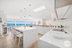  24 Mulubinda Parade Corlette NSW 2315 $2,950,000 - $3,245,000 This majestic, master-built residence located in one of Port Stephens most sought-after locations combines spectacular panoramic water views over Port Stephens with an outstanding interior design. Solid in its suspended concrete construction and superbly crafted in an elevated north facing position, this residence comprises of four bedrooms of accommodation, three bathrooms, various living areas and captures stunning 180-degree views from multiple levels and areas throughout the home. The open plan layout melts the kitchen area with grand living and dining spaces in a light filled ambience with blue vistas through a premium panoramic window front and sky lights. Exclusivity and quality at the highest level wherever you look. A high end kitchen built by the award winning team at Latham Kitchen designs comes equipped with a one-piece stone bench top, automated cupboard doors, SMEG appliances like induction cook top, dual ovens, and plate warmer as well as a built-in coffee machine. Kitchen cupboards are fitted with internal drawers for easy access and organised storage. You'll also find an adjoining Butler's Pantry with integrated fridge and further preparation space for the Master Chef's or entertainer. Nothing has been missed when it comes to this premium gourmet design. The bathrooms come with exceptional comfort and style. Designed with care and thought, they include underfloor heating, heated towel rails, generous shower recess complete with niche and linear drains, an elegant free-standing bathtub, and are tiled floor to ceiling with feature walls and floating vanities. When it comes to outdoor living, spend the summer entertaining on the balcony or on the terrace where you overlook the swimming pool and take in the panorama across this magnificent waterway. These views are unbeatable, and you are only 580m from the water's edge. Indoor comfort is also taken care of with solar hot water, ducted air conditioning, an open fireplace and sea breezes. The layout of the residence allows for separate living on the lower level, if so desired, and comes complete with bedroom, bathroom, kitchenette and living area. This space can be accessed internally or made private with external access. Perfect as a retreat or an additional income earner. Dual street frontage provides additional access via the cul-de-sac of Myan Close to the off-street parking spaces as well as the spacious double garage, workshop, and storage area. 