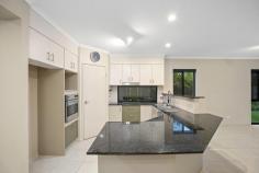  30 Sagitta Place Robina QLD 4226 $1,599,000 Set in a quiet cul-de-sac in the highly sought after Robina estate “The Gallery” is this impressive double storey home boasting a generous functional 37 square floor plan that will provide plenty of room for the entire family. Privacy will not be an issue with living areas both upstairs and down, 5 extra large bedrooms, and the master suite boasting so much space it will make the perfect parents retreat. This property uniquely has dual street frontages with a pedestrian gate onto Lyra Court. Surrounded by beautiful tree lined streets, numerous parks and the Palmer Golf Course, you will be spoiled for choice where to take a leisurely stroll. • Three separate living areas – panoramic hinterland views from the upstairs living • 4 extremely spacious bedrooms upstairs plus a study/5th bedroom downstairs • Two bathrooms plus a separate powder room • Modern open plan kitchen with granite benchtops • Solar heated swimming pool and spa with feature waterfall • Private alfresco entertaining area with built-in BBQ • Ducted air-conditioning throughout, central vacuum system, security system • Double lock-up garaging and additional off-street parking • Quality solar system with 24 panels, 2 gardens sheds • Low maintenance fenced yard with established gardens including fruit trees Conveniently positioned in close proximity to quality schools such as Bond University, Somerset College and All Saints. There are also numerous shopping options available with Robina Town Centre, the Q-Super Centre and Pacific Fair all within a short drive. The hospital, train station and M1 are also easily accessible. 