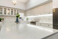  18 Hereford Close KINGSHOLME QLD 4208 Nestled on a secluded 4,968sqm block in the luxurious Montego Hills Estate, surrounded by lush native bushland, lies this grand and opulent 567sqm custom design residence. Built in 2018, this luxurious abode offers ample space and an array of lavish features to cater for every need. As you enter the property, you are greeted by the grandeur of the main entrance, which flows throughout both storeys and culminates with a ceiling that soars to over 4 meters high. The large proportions of the residence are evident in every room, making it perfect for both family living and entertaining guests. The property boasts 6 bedrooms, all with built-in wardrobes/walk-in wardrobes, providing ample storage space. The 2 main bedrooms, one upstairs and one downstairs, are the epitome of luxury and both feature walk-in wardrobes and ensuites, allowing for complete privacy and convenience. The home features 3 bathrooms + a powder room, all with Caesarstone benchtops and Carrara marble features, exuding luxury and opulence as well as 3 separate living areas, each designed to provide the ultimate in comfort and relaxation. The large open plan kitchen, lounge, and dining room features a faux fireplace (gas), perfect for chilly evenings. The media room is designed with acoustic insulation in the walls, providing the perfect space for movie nights with family and friends. The large multi-purpose room or 7th bedroom with built-in cupboards is perfect as a guest room or even a home office. The gourmet kitchen is a chef's dream, equipped with Caesarstone bench tops, a 900mm gas cooktop, electric oven, dishwasher, ducted range hood and Carrara marble splashback. The butler's pantry and study nook are off the kitchen, providing ample space for meal preparation and storage. The separate laundry room also features Caesarstone bench tops and ample storage and cupboards, making laundry a breeze. The property also features a 22,500L in-ground rainwater tank, Krystel Kleer (BioCycle) wastewater treatment system, insulation in all internal and external walls, floor, and ceiling, and acoustic insulation in between storeys. The property is also equipped with security doors and screens, fly screens, ceiling fans, and LED downlights throughout. It has a bottle gas hot water unit and is NBN connected with data points in every room hardwired for internet connection. This residence is truly a masterpiece, seamlessly blending luxury and functionality. With its grand proportions, spacious living areas, and an array of luxurious features, this property is the epitome of luxury living. Features: • 567sqm custom designed residence on a secluded 4,968sqm block • Built in 2018, with grand entrance and high ceilings • 6 bedrooms with walk-in robes and ensuite in main bedrooms • 3 bathrooms (plus a powder room) with Caesarstone benchtops and Carrara marble features • 3 separate living areas and a gourmet kitchen • Double lock-up garage and separate laundry • In-ground rainwater tank, wastewater treatment system and insulation throughout • Security features, LED downlights and Bottle gas hot water unit • NBN connected and data points in every room • 19.61kw Solar System 