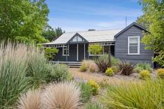  57 Duke St Daylesford VIC 3460 $1,195,000 The checklist for your dream Daylesford property will surely feature an attractive, comfortable home, private surrounds where you can relax and entertain and of course a stellar, central address. 57 Duke Street returns an enthusiastic tick to each of these. A period home with a contemporary edge and landscaped gardens on 950sqm (approx.) promises something special. Step up onto the sheltered veranda and turn the key to the renovated residence exuding warmth, style and comfort. Hydronic heating, two split systems, quality blinds and timber floors are desirable inclusions. Three bedrooms with ceiling fans lead off the central hallway. The generous master bedroom incorporates a sitting/dressing room with a wall of robes and powder room. The second is also large with robes and access to its own private courtyard while the third, with a built-in timber desk, has you ready to work from home. The modern family bathroom offers a stepless shower, floating vanity and incorporates a European style laundry. The floorplan opens at the rear to the kitchen and generous living and dining space. The designer kitchen has stone benchtops and abundant storage featuring quality Fisher and Paykel appliances, an induction cooktop with single wok gas burner, electric oven and dishwasher. Timber bi-fold doors and a set of French doors flow to two separate alfresco areas, almost doubling your entertaining space. The sheltered decked area is the perfect spot for an aperitif before you stroll into town for dinner. The leafy rear yard is complete with the aforementioned flagstone paved entertaining space, lush lawns and includes a bank of sheds to configure as you wish. With Cornish Hill Reserve behind you and lake Daylesford just a few hundred metres away, you are truly surrounded by Daylesford's best assets. 