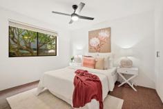  2 / 66 Riverton Street CLAYFIELD QLD 4011 This delightful two-bedroom apartment in one of Brisbane's best suburbs is sure to impress. Situated on the first floor of a well-kept 1970s complex, you'll notice the light and space immediately. There's room to move, relax. With honey-toned wood flooring underfoot, and large windows throughout, the whole apartment feels airy and welcoming. The spacious living and dining area flows to a large, tiled balcony. There's a modern, fitted kitchen with dishwasher, oven and electric cooktop, and lots of storage. The bathroom features a walk-in shower, with monsoon fittings, and attractive cabinetry. Both bedrooms are fully carpeted and feature built-in robes, with extra storage in the hall. The apartment feels cool but for those hot Brisbane summer days, there's air-conditioning in the main living area and fans in both bedrooms. Downstairs, there's secure parking in an extra-large garage, with laundry facilities and internal stairs up to the apartment. The front entrance to the block is also fully secure, with intercom access to each unit. Set on a wide, leafy street, this apartment offers space and style in a superb location just moments from everything. Surrounded by beautiful homes, tree-lined Riverton Street is set right in the heart of one of Brisbane's most established and desirable suburbs. There is excellent access to major schools, shopping centres, and express transport links to the CBD and beyond. It's an easy 400m walk to the buses on Sandgate Road. 