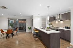  17 McEwan Dr Cranbourne East VIC 3977 $675,000 - $740,000 This stunning 4-bedroom, 2-bathroom, 2-living spaces and 2-kitchen home offers convenience, comfort and style. Situated in the desirable Parks Edge Estate, this property is perfect for families and professionals alike. Upon entry, you will be greeted by a sense of spaciousness with an abundance of natural light. The open-plan design features two generously sized living zones and continues into the kitchen and dining area, which features modern appliances and ample storage space. The bedrooms are all well-proportioned, with the master bedroom offering a walk-in wardrobe and a luxurious ensuite. The further 3 bedrooms feature BIR's and are serviced by a stylish main bathroom, which has a bathtub and separate shower. The outdoor entertaining area is perfect for hosting barbecues and gatherings with friends and family. The large backyard provides plenty of space for children to play, while the double garage provides secure parking for your vehicles. Features include: - Fully rendered stylish facade - Sizeable 451m² allotment - Quality timber look flooring and carpet throughout - Ducted heating and evaporative cooling - Double garage with external and internal access - Abundant natural light and downlights throughout - Plenty of storage with WIR to master and BIR's to minor bedrooms - Security alarm connection to all entry and outdoor access doors - Two driveways and two roller doors - Back access to the property for additional parking This home is located within walking distance to the substantial Casey Fields precinct, close to a variety of local amenities, including shops, parks, and top rated schools such as Casey Fields Primary School and Wilandra Rise Primary School. The convenient location makes it easy to access major roads and public transportation, making it an ideal home for those who need to commute to Melbourne's CBD. 