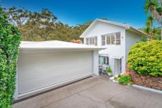  48 Navala Avenue Nelson Bay NSW 2315 $1,350,000 Offering an enviable lifestyle opportunity in one of Nelson Bay's most desirable settings, this substantial two-story entertainer enjoys a premium treescape view and offers dynamic potential. Commanding presence over a 565m2 parcel of land, this one is the ultimate box ticker! This lifestyle property of effortless style and luxury appeal, delivering an unparalleled family lifestyle experience with its premium features and versatile entertaining zones. Radiant and beautifully rendered, crisp white plantation shutters, raked ceilings, sleek timber accents and time honoured proportions deliver exceptional wealth throughout the home. The stunning, well-equipped gourmet entertainers kitchen is perfectly positioned to provide a seamless integration of indoor and outdoor entertaining, whilst remaining a central hub in the heart of the home. Unfolding onto a truly special, covered deck entertaining area designed to entertain year-round and this unique space will become host to many future events and celebrations with family and friends. You fall in love with this space as you appreciate the serene outlook and privacy the treescape offers. Impeccably maintained, the home is comprised of five generously proportioned bedrooms each with ample storage space, a master suite that seconds as a parents retreat with an inbuilt bath in the en-suite and private balcony, study, three spacious living areas with the ability to create the third into a study space or sixth bedroom, three bathrooms and ducted air conditioning. In addition, a separate guest quarters occupies the top level of the home and includes a full kitchenette, bathroom and studio living/bedroom space. Raked ceilings enhance the size of the room and make this a comfortable space for guests, teenagers, family or even as a second source of income. Completely separate, the guest quarters is accessed from the front of the property through a secondary front door. Complete with a low maintenance rear yard and expansive double lock-up garage, this property is a must see! 