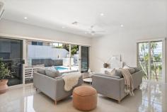  14 Dockside Avenue Corlette NSW 2315 Delivering a commanding street appeal, this exquisitely presented residence exhibits with modest grandeur and luxury interiors to epitomise the unique quality of craftsmanship. Spanning over a substantial 703m2 parcel of land and located in one of Port Stephens most prestigious locales the 'Vantage Estate', this residence provides the ultimate family or retirees dream. Previously featured in the Hunter Lifestyle magazine for its impeccable architectural design, this unique single level residence will blow you away! Enveloped by manicured lawns and gardens, you are invited into the home by a grand entrance hall an air of sophistication permeates throughout the home and combines a natural, calm colour palette to accentuate the spacious interiors. Escape to your own five-star resort in your backyard and enjoy a private and serene covered alfresco, complemented by a breath taking inground pool and water feature. The gourmet kitchen has been finished with high quality inclusions, stainless steel appliances, a large electric cooktop and built-in dishwasher. Setting the benchmark for indulgent outdoor entertaining, the residence is complete with multiple interconnecting living spaces to allow for seamless indoor/outdoor flow. Offering four oversized bedrooms of accommodation, all with ducted air conditioning, ceiling fans and built in wardrobes. The master wing of the home has been established to accentuate space, privacy and ease of living, with a private covered alfresco, enormous walk in wardrobe and lavish en-suite bathroom. Complete with a double lock up garage, this magnificent family residence is positioned all within an approx. 2km drive to Salamander Bay Shopping Centre, parklands and schools. 