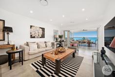  24 Mulubinda Parade Corlette NSW 2315 $2,950,000 - $3,245,000 This majestic, master-built residence located in one of Port Stephens most sought-after locations combines spectacular panoramic water views over Port Stephens with an outstanding interior design. Solid in its suspended concrete construction and superbly crafted in an elevated north facing position, this residence comprises of four bedrooms of accommodation, three bathrooms, various living areas and captures stunning 180-degree views from multiple levels and areas throughout the home. The open plan layout melts the kitchen area with grand living and dining spaces in a light filled ambience with blue vistas through a premium panoramic window front and sky lights. Exclusivity and quality at the highest level wherever you look. A high end kitchen built by the award winning team at Latham Kitchen designs comes equipped with a one-piece stone bench top, automated cupboard doors, SMEG appliances like induction cook top, dual ovens, and plate warmer as well as a built-in coffee machine. Kitchen cupboards are fitted with internal drawers for easy access and organised storage. You'll also find an adjoining Butler's Pantry with integrated fridge and further preparation space for the Master Chef's or entertainer. Nothing has been missed when it comes to this premium gourmet design. The bathrooms come with exceptional comfort and style. Designed with care and thought, they include underfloor heating, heated towel rails, generous shower recess complete with niche and linear drains, an elegant free-standing bathtub, and are tiled floor to ceiling with feature walls and floating vanities. When it comes to outdoor living, spend the summer entertaining on the balcony or on the terrace where you overlook the swimming pool and take in the panorama across this magnificent waterway. These views are unbeatable, and you are only 580m from the water's edge. Indoor comfort is also taken care of with solar hot water, ducted air conditioning, an open fireplace and sea breezes. The layout of the residence allows for separate living on the lower level, if so desired, and comes complete with bedroom, bathroom, kitchenette and living area. This space can be accessed internally or made private with external access. Perfect as a retreat or an additional income earner. Dual street frontage provides additional access via the cul-de-sac of Myan Close to the off-street parking spaces as well as the spacious double garage, workshop, and storage area. 