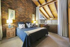  250 Tallebudgera Creek Road Tallebudgera Valley QLD 4228 $2,600,000 Discover a special sanctuary at “Twin Ponds”, where tranquillity prevails amongst 3.9 peaceful and private acres. Set well back from the street, an architecturally designed country chalet rises up from the end of a long tree-lined driveway. Rich with warmth and charm, soaring raked ceilings with exposed rafters complement the timber floors, feature lighting and exposed brickwork, including in the formal lounge and dining zone where a roofline peaks at 5.7m high. Relax here or in the sunken lounge where galleries of glass invite in gorgeous views of the grounds. A modern country kitchen with butler's pantry is another highlight, while four bedrooms and two bathrooms promise cozy comfort. Enticingly, the acreage is equipped with a light, bright second residence for dual living. Comprising two bedrooms, a bathroom, stylish kitchen and open plan living and dining, it's separately metered and is a handy way to offset your mortgage. Outdoors, enjoy an endless summer in the heated resort-style pool and spa, gather around the fire pit to stargaze and share stories, or make the most of the cathedral-style alfresco pavilion, perfect for picnics or outdoor entertaining. Kids will love the flying fox, plus get a taste of sustainability with a thriving orchard and a veggie patch. Horse lovers, you're well catered for too. An equestrian paradise, it boasts two purpose-built stables, a round yard and three paddocks. Two spring-fed dams keep them hydrated, and you'll love being just a few minutes drive from the Tallebudgera Pony Club. Nestled within a natural wonderland, this hinterland haven still offers central convenience. St. Andrew's Lutheran College, Tallebudgera State School and local shops are just four minutes by car, or you can swap the bush for the beach in 12 minutes. So don't miss your chance to embrace an acreage lifestyle and a location you'll love – arrange an inspection today. Main House Features Architecturally designed country chalet, constructed from double brick and cedar wood Soaring raked ceilings with exposed wooden rafters plus feature lighting and timber floors throughout Modern country kitchen with thick stone bench tops, oversized centre island bench, stainless steel appliances including a 5 burner induction cooktop and oven Butler's pantry/laundry with sink, ample storage and access to a private courtyard Sunken lounge room wrapped in high-set glass windows, with feature fireplace and slate floors Formal lounge and dining with gas fireplace and ceilings soaring to 5.7m high, leads onto an expansive outdoor entertaining deck Master suite with exposed brick feature wall, 4.9m raked ceiling, built-in robe and views down to the formal lounge Renovated bathroom with feature brick bathtub, dual head shower, vanity, garden views and a separate toilet Three upstairs bedrooms, including two with built-in robes and one with attic storage Upstairs bathroom with shower/bath, vanity and separate toilet Office Multipurpose room with sink and vanity Foyer/mudroom with barn door Crimsafe screens Air-conditioning and ceiling fans Triple car garage with extra height clearance and a separate double carport Oversized heated resort-style pool, spa and pool cabana Firepit area overlooking picturesque ponds Cathedral-style alfresco pavilion with power and water, perfect for picnics or outdoor entertaining Flying fox for the kids Cottage Features Large kitchen with island bench, stainless steel oven and induction cooktop Spacious and light-filled lounge and dining, with access to a covered outdoor deck Master bedroom with built-in robe and access to a two-way bathroom Bedroom 2 with built-in robe Stylish bathroom with shower, vanity and toilet Laundry with sink, storage and access to a drying courtyard Covered deck Single carport Separately metered Other Features Peaceful and private 3.9 acre estate Set well back from the street and accessed by a long tree-lined driveway with electric gates 13.1kW solar system plus solar hot water Grass round yard Two stables/holding shelters with power and water Three fenced paddocks Town water plus bore water servicing vegetable garden Water tank servicing cottage laundry and toilet and irrigation Two springs fed dams Chicken pens Plethora of bird life Orchard and a veggie patch with storage shed: includes walnuts, star fruit, lemons, limes, mandarins, persimmons and avocados Location Approx. 3 mins to Tallebudgera Pony Club Approx. 4 mins to Tallebudgera State School, local shops and Man on the Bike Pizza Approx. 4 mins to St. Andrew's Lutheran College Approx. 4 mins to Schuster Park and Coplick Family Sports Park Approx. 12 mins to Burleigh Heads Approx. 14 mins to Palm Beach Approx. 35 min to Surfers Paradise 