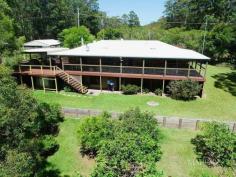  19 Granite Ln Curramore QLD 4552 Enjoy the 20-minute scenic drive from Maleny to this mountain hideaway. Character home with big verandahs set in a quiet private cul-de-sac. Beautiful bushland setting with lots of native birds and wildlife. A great feature of the home are the dressed timbers throughout with high ceilings in the open-plan living area. Woodheater, family-size kitchen and dining. There are 3 bedrooms upstairs and a bonus self-contained unit under, ideal for extended family or guests. Fruit trees on the landscaped terraces and sheds for workshops or studios. Present owners of 10yrs are reluctantly downsizing. The ideal holiday home or full-time residence. 19 Granite Lane Curramore 