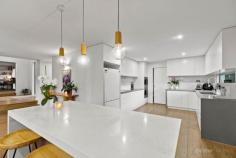  97 Winona Rd Mount Eliza VIC 3930 $2,450,000 -$2,650,000 Offering an abundance of space and luxurious living, this sensational home on a substantial block of over 2/3 of an acre is a true lifestyle property for the family. Located within the leafy surrounds of Mt Eliza's prestigious Woodlands, the impeccable 2-storey home enjoys bay views from the 1 st floor and is set behind security gates, with a circular driveway providing ample off-street parking plus a large double garage within the landscaped front gardens. At its heart is a superb entertainer's kitchen providing stone benchtops, a central island, streamlined cabinetry plus butler's pantry, and quality appliances including double Smeg oven, 6-burner ceramic cooktop and Miele dishwasher. A choice of living areas includes a generous lounge room with wood heater, a large rumpus room, and an expansive family and dining room embracing indoor-outdoor living via a glass wall of stacking doors opening to an enviable alfresco space. Family and guests will revel in the surroundings, with a sublime gas-heated saltwater pool and spa, extensive decking and tranquil cabana, full-size tennis court, and plentiful lawn area which also includes monkey bars and a treehouse, perfect for the kids! Ample accommodation begins with a study/bedroom on the ground floor, then the floating staircase leads upstairs to 3 queen-size bedrooms. A magnificent master retreat boasts a balcony overlooking the pool and garden, plus a walk-in-robe, while the ensuite is 1 of 3 impressive bathrooms across both floors. A bonus 6th bedroom is found in the spacious separate bungalow/retreat which includes reverse cycle air-conditioning, plus bathroom and sauna. Additional features of this flawless home include engineered timber floors, ducted heating/cooling throughout, large fitted laundry, and sizeable vegetable garden. Moments from local shops, it's also an easy drive to prestigious schools, shopping hubs, beautiful beaches, parks and transport options. 
