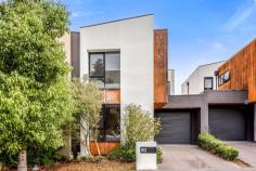  80 Ellsworth Crescent Camberwell VIC 3124 $1,080,000-$1,180,000 This is the ideal opportunity for first home buyers, young families and investors. Positioned just metres from The Crossway Peak walking trail and Lynden Park, and within walking distance to local schools and sporting facilities, this modern double storey townhouse is also just minutes drive from Deakin University. Sporting a stunning contemporary facade featuring raked parapet walls, full render, LED drive lights and rich timber panels, the home is landscaped nicely and includes a paved driveway and lock-up garage. First impressions are appealing, with entry into a spacious living room showcasing luxe timber laminate flooring, high square-set ceilings, LED down lights and an eye-catching full-height timber frame accentuating the L-shaped staircase. The home utilises the natural gradient of the land and steps down to an open-plan layout, with raked ceiling heights increasing beyond 3000mm, creating a wonderful feeling of spaciousness. Heating, cooling and an alarm are all notable inclusions. Outside, a private courtyard awaits, hedged for privacy and adding a paved BBQ area and water tank. There's no compromising on space or quality in the luxurious kitchen, with a walk-in pantry and seamless handle less cabinetry in abundance. 40mm stone bench tops are accentuated by a black glass splashback and elegant gooseneck mixer and sink. Integrated cooking appliances and a stainless steel dishwasher are in excellent condition. The main bathroom is equally luxurious with a tiled hob bathtub and designer sink and tap ware. Atop a delightful timber staircase, three large bedrooms branch off a dedicated sunny study nook and enjoy a plentitude of built-in robe storage. The master suite boasts a make-up nook and private ensuite showcasing full height wall tiles, a mosaic feature tiled wall, oversized frameless shower and mirrored vanity unit. As well as being close to schools, parks, playgrounds and bus routes, the home is also within close proximity to shopping, dining and the prestigious Deakin University. Property Specifications: · Three bedrooms, two open living areas, private courtyard, stunning contemporary facade · Highly appointed bathrooms and kitchen with walk-in pantry · Very high raked ceilings, LED lights, heating, cooling, alarm · Single lock-up garage · Adjacent to walking track and park, close to bus stops, schools and shops · Minutes from university 