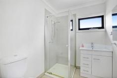  6C Cheddar Rd Reservoir VIC 3073 Live with the luxury of space minus the high-maintenance factor with this family-sized townhouse in the heart of Reservoir! Spanning across two fashionable floors with four spacious bedrooms, two modern bathrooms, high-quality contemporary finishes and indoor-outdoor lifestyle enjoyment, it has all the space you need on a very manageable scale. Warm timber floors flow with style throughout the vast open-plan living domain, overseen by a deluxe kitchen and effortlessly extending onto a private and peaceful backyard ideal for relaxed morning coffees or casual entertaining with friends. Three spacious bedrooms (master with ensuite) are zoned for privacy upstairs, while a fourth bedroom downstairs offers family flexibility. Climate-controlled with split-system heating/cooling, this fantastic first home, smart investment or option for the young family and downsizers also features its own street frontage, high ceilings, plenty of natural light, separate study area, separate laundry, alarm and a single car space. Enhancing your standard of living is the unbeatable lifestyle location, which is within easy walking distance of Broadway and Edwardes Street shops and cafes, Reservoir train station, bus services, schools, Reservoir Leisure Centre and Edwardes Lake Park. 