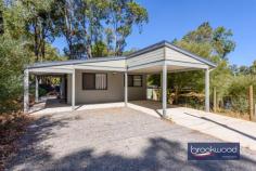  2 Grenville Rd Stoneville WA 6081 $599,000 Whether you are looking for an investment opportunity or a purpose-built dual occupancy property, these 2015-built Stoneville homes could be the answer. Separate 2-bedroom, 1-bathroom homes, a large alfresco entertaining area and a below-ground pool are situated on a 2008 sqm corner lot; both homes are bathed in natural light and look out to a classic Hills landscape. Two x 2 bed 1 bath homes 2008 sqm dual occupancy 2015-built Hardi and iron Central alfresco w BG pool Well-appointed kitchens Semi ensuite bathrooms Reverse cycle air con units Sea container workshop Dual frontage corner block Community and autonomy Dual occupancy properties offer tremendous versatility, a family home with a granny flat or guest house, or a rental property. Choosing to live with extended family close by while maintaining privacy and autonomy is an increasingly attractive proposition. A modern multi-generational lifestyle lets you care for parents or grandparents and provides an extended support system for younger generations. It can strengthen family relationships, provide the opportunity for shared experiences and give children an invaluable connection to their family history. This old-but-new-again model offers a practical and rewarding approach to a more sustainable, community-orientated approach to life. Both residences use a two-bedroom, one-bathroom layout, with the principal residence featuring a large main bedroom opening to an expansive alfresco entertaining area. Semi-ensuite access, well-appointed kitchens and good-sized living rooms ensure a delightful sense of space and light. A high gable roof shelters the central outdoor living zone and below-ground pool – this social space can act as a buffer between the two residences or a convivial shared space – an idyllic backdrop to memory-making. Purpose-built with separate driveways and fencing to ensure each home enjoys privacy and autonomy, this property delivers the flexibility to use the second home to generate rental income or as a comfortable home with a wonderful sense of independence for parents or adult children. Stoneville offers a laid-back lifestyle with easy access to modern conveniences, a choice of schools, sporting facilities and a sense of peace, tranquillity and connection with nature. 