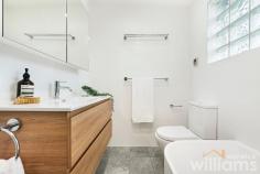  51 Australia St Camperdown NSW 2050 With its leafy park side location, abundance of great eateries, and easy transport options this charming three-bedroom terrace delivers a fantastic inner-city lifestyle. Beautifully presented, the stylish interiors blend thoughtful upgrades with pristine heritage features to create a warm and welcoming home. Providing plenty of space for young professionals and growing families alike, the generous lower level includes lounge, separate dining area, and stunning designer kitchen. While the bright and sunny upper level has two guest bedrooms, plus master with an ornate balcony that overlooks Camperdown Park. Entertain friends and family, or simply relax, in the private and spacious courtyard framed by established greenery. A convenient Camperdown location means vibrant King St, Newtown train station, CBD buses, and local parks are all within a 1km radius. • Delightful heritage three-bedroom home in a prized end-of-terrace position • Light-filled layout with separate lounge and dining rooms, both with original fireplaces • Sleek and modern kitchen featuring self-cleaning electric oven, Bosch dishwasher • Cleverly concealed laundry with room for washing machine and separate dryer • Large designer bathroom with deep bath and combined waterfall shower • Two bright and sunny guest bedrooms, one with built-in robe and storage • Large master bedroom featuring original fireplace, built-in robe, and private balcony • Timber flooring throughout. Ceiling fans. Period features. Security grills • Large courtyard accessible from kitchen. Rear lane access and parking. 