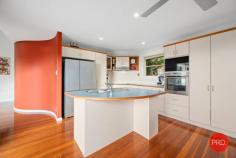  18 Ramornie Drive Toormina NSW 2452 $869,000 - $899,000 In an elevated position with a perfect North East aspect is this impressive 3 bedroom home. Capturing cooling sea breezes and with a wonderful outlook this home will surprise you. From the moment that you enter through the front door and are met with stunning polished timber floors you immediately realise that this home is not your average 3 bedder. The raked ceilings in the living area give a great sense of space and lots of windows provide ample natural light. The 3 bedrooms are all a great size and there is also the bonus of a large office with 2 built in work stations. The generous main bathroom features mosaic tile highlights. The ensuite is also finished to a high standard and is larger than most main bathrooms. The central kitchen is great for the entertainer and provides the chef with an opportunity to interact with people whether they are seated at the dining table, on the deck or in the living room. There are a multitude of options for outdoor entertaining, with a large deck leading off the living area and a second deck off the dining area. Both have a pleasant outlook over the beautiful tropical gardens and out toward Sawtell on the horizon. The gardens are immaculately maintained and there is enough room for a vegie patch with easy access to the yard from the drive through double garage. There is also a dedicated parking space for a boat or caravan. Convenience is also a massive selling feature with a major shopping centre only a stone's throw away, schools within walking distance and the beautiful beaches,cafes and restaurants of Sawtell within approximately a 5 minute drive. If you've been searching for an above average home with a unique design then this home is for you. 