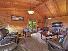  340 Mount Best Tin Mine Rd Toora VIC 3962 $795,000 Surround yourself with nature and enjoy total privacy and seclusion on approx. 7.58 stunning acres of lush rainforest. A truly unique sheltered pocket of paradise teeming with birds and wildlife. Long all-weather driveway leads you to a world of your own with towering tree ferns, pockets of colourful gardens, orchard and places to sit and enjoy the tranquility. A wide deck welcome you into the home with views out to the surrounding countryside and distant coast. Soaring cathedral ceilings with huge beams create a wonderful feeling of space with an expansive living room, modern central kitchen and adjoining dining area, all flowing out onto the deck making this an entertainer's delight. Comfortable in every season with a wood heater plus the convenience of a RC/AC. There are three bedrooms, central bathroom and laundry / utility space. Practical features include satellite TV and NBN, abundant water storage, solar power system plus mains, solar hot water, flat parking for multiple cars, LU garage / workshop with lights, power and concrete floor, carport / boat / van storage, guests parking area. Just 15 minutes from town, school bus passing and 5 mins from the welcoming Mount Best hall and community hub. If you are seeking something extraordinary then this is a must see. 