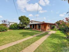  63 Ready St Rutherglen VIC 3685 $475,000 This well built and fastidiously maintained, (4) four bedroom family home, sitting on a fully fenced 1107m2 block is an amazing opportunity for the first home buyer or investor alike. Area 1107m2 (Approx.) Location Situated in the historic wine-growing town of Rutherglen in North-East Victoria, 10 minutes from the Murray River, 46 km from Albury and 42km from Wangaratta. Residence This home with its big windows, central under floor heating, ceiling fans, evaporative cooling and split system air conditioning is a very pleasant and comfortable place to spend time. At the centre of the home is a wonderful retro kitchen, with breakfast bar, dining area, lounge and sliding glass door out onto the covered alfresco area. To the front of the home is a second large living area with wall-to-wall carpet and views to the street. There are (4) four bedrooms, (3) three with built in robes, all with large windows for natural light and to catch a summer breeze. The bedrooms are serviced by a freshly renovated (2) two-way family bathroom. Garden & Surrounds Outside the yard is neat and tidy with beautiful established garden, green lawns, raised vegetable garden beds and citrus trees. Shedding Featuring a fantastic 5.4m x 7.6m lock up garage/workshop with concrete floor and power. Single carport off the side of the house. Even under cover shelter for the tinny. Access to garage/workshop down the side of house. 