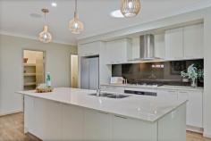  12 Griffin Pl Coes Creek QLD 4560 This thoroughly impressive, contemporary home is a wonderful example of utilizing & maximising every square metre of the property to enjoy. Starting with outstanding street appeal in this quiet cul de sac, the home presents a welcoming statement in style. Upon entering, the WOW factor is immediately evident with high ceilings, an open plan layout with generous room dimensions and extensive use of glass windows and doors seamlessly connecting with another world of outside leisure areas to discover and enjoy. Extraordinary entertainment options here, offering multiple, unique & separate leisure retreats internally & externally. Step out from the open plan living and take your choice of relaxation areas: The Bali Hut / Zen area – chill zone The Outback Bunker Bar – iced beer and bubbles – no stress here ! The Indoor / Outdoor Bar & Servery – perfect for snacks & nibbles Alfresco dining & BBQ area – dinner is served The sparkling in ground pool – including spa jet bench seating. Internally, the central hub of the home is a Gourmet Chefs kitchen with 900mm Gas stove & oven, oversized Caesarstone preparation area and Breakfast bench, extensive cupboards and (2 not 1) walk in pantry & storage closets, a pryolitic (self cleaning oven). The kitchen is also an excellent vantage point, providing direct visual contact with the pool area and several outdoor leisure settings. The Master bedroom, situated at the back of the house offers a large Resort style luxury ensuite, huge walk in robe and has direct access to the deck & leisure areas. The home theatre room has a sophisticated Bose & Nile speaker entertainment system with connecting surround sound speakers throughout the living & outdoor areas. So many other features and attention to detail to discover throughout this home, including: 5kw Solar electricity system with a hybrid converter – ready for battery connection. Cisco electrical data cabling throughout. Steel frame construction with 25 year Metricon guarantee Termicide pest system installation A natural forest vegetation backdrop (no rear neighbours) – plus it's just a short stroll through the forest to the local shops & café's. Close convenience to the local shops, a selection of schools, Bus & Rail transport & services. This home will be an absolute pleasure to inspect and discover and - it could be all yours. 