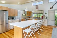  429 MOUNTAIN VIEW ROAD MALENY QLD 4552 $1,380,000 This stylish and much-loved home is perfectly positioned and designed to capture one of the absolute best views of the Glasshouse Mountains and beyond. The current owners have created an enviable space with a neutral palette that allows the view and very pretty block to shine. Views are on offer from every room and the deck has been extended and elevated to include a large sundeck; you'll feel on top of the world as you step out. Delighted family and friends will love to gather with you in your Hinterland home; the open kitchen, dining and lounge area is the heart of home and leads out to the timber decks and entertaining space. With three bedrooms, the master offers a lovely en suite with twin sinks and double shower heads in the extra long shower. The second bedroom has its own en suite and would be ideal for guests, teenagers or dual living. Just off the master bedroom is a sunroom that would be the perfect study, dressing room or exercise space. With its very pretty block, excellent floorplan for guests and those views, this home offers so much potential for accommodation for the wedding and tourist market. Just a 4-minute drive away is the bustling township of Maleny and all its amenities; primary and secondary schools, medical centres, hospital and of course its celebrated cafes, restaurants and shopping. • Panoramic views to the Glasshouse Mountains, the Sunshine Coast and Brisbane City • Deck extending the length of the home with an elevated sundeck • Stylish and modern open plan kitchen, dining and lounge • Cook friendly kitchen with substantial storage, an island bench, workspace and a walk-in pantry • Gas cooktop, electric oven and dishwasher • Master with access to the deck, a large walk-in robe and en suite with twin sinks and double shower heads • Sunroom off the master perfect for a dressing room • High raked ceilings • Fireplace and air conditioning in the living area and master • Fans throughout • Tasmanian Oak flooring throughout • Large windows and high louvered windows to capture the breeze, view and light • Laundry perfectly tucked away off the kitchen for easy access • Resident birdlife; Magpies, Butcher Birds, King Parrots, Rosellas, and Lorikeets • Fully fenced 4016 sqm2 block • Thoughtful plantings to create privacy, established gardens and lawn • Solar power and solar hot water • 2 car remote garage and workshop • 2 x 22,500L tanks • Parking space for the caravan, boat or trailer Such a delightful piece of property, iconic location, a stylish home and incredible views must be inspected today. 