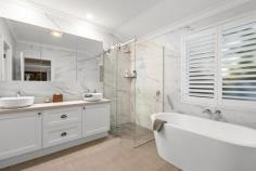  21A Duncraig Rd Applecross WA 6153 Positioned on one of the most prestigious streets within Applecross, this lock and leave home has been designed with a timeless architectural style and has been extensively renovated with exquisite quality and designer finishes to create a timeless home ready to move in and enjoy. Enter via secure electronic gates and be welcomed through the grand provincial wooden doors into this stunning residence. Cleverly designed and completed with quality, the home features polished timber floorboards, high ceilings, wrought iron balustrading and stone bench tops. The layout provides a spacious open plan kitchen, living and dining area on the ground level which has been recently renovated with wow factor. The kitchen includes island bench with breakfast bar, pendant lighting, stone bench tops and quality appliances. The adjoining living room has a stone gas fireplace, timber floorboards and overlooks the outdoor area. There is also an additional lounge room with fireplace, separate formal dining/theatre, powder room and separate laundry on this level. There is also a large alfresco area complete with fan that overlooks the glistening swimming pool. Upstairs comprises three double bedrooms all with built in robes and a grand master suite that features adjoining sitting room/library/nursery, his and hers wardrobe and luxurious bathroom ensuite which has been updated with free standing bath, double vanity and the most up to date finishings. The grounds are surrounded by established gardens though are easy care and reticulated. Whilst designed with a timeless style, this home has the latest in modern conveniences including ducted reverse cycle air conditioning, security alarm and an abundance of storage. There is a double lock up garage and generous store room/workshop/wine cellar. This location is within 10 minutes easy walking distance to the very best features within this riverside suburb. Stroll to the popular Applecross Village café strip, riverfront foreshore, Heathcote parklands, Yacht Club, Tennis Club and Primary School. 