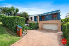  18 Ramornie Drive Toormina NSW 2452 $869,000 - $899,000 In an elevated position with a perfect North East aspect is this impressive 3 bedroom home. Capturing cooling sea breezes and with a wonderful outlook this home will surprise you. From the moment that you enter through the front door and are met with stunning polished timber floors you immediately realise that this home is not your average 3 bedder. The raked ceilings in the living area give a great sense of space and lots of windows provide ample natural light. The 3 bedrooms are all a great size and there is also the bonus of a large office with 2 built in work stations. The generous main bathroom features mosaic tile highlights. The ensuite is also finished to a high standard and is larger than most main bathrooms. The central kitchen is great for the entertainer and provides the chef with an opportunity to interact with people whether they are seated at the dining table, on the deck or in the living room. There are a multitude of options for outdoor entertaining, with a large deck leading off the living area and a second deck off the dining area. Both have a pleasant outlook over the beautiful tropical gardens and out toward Sawtell on the horizon. The gardens are immaculately maintained and there is enough room for a vegie patch with easy access to the yard from the drive through double garage. There is also a dedicated parking space for a boat or caravan. Convenience is also a massive selling feature with a major shopping centre only a stone's throw away, schools within walking distance and the beautiful beaches,cafes and restaurants of Sawtell within approximately a 5 minute drive. If you've been searching for an above average home with a unique design then this home is for you. 
