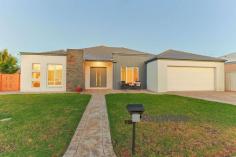  1 Hugo Court Mildura VIC 3500 $565,000 - $621,000 Principal & Elite Sales Agent at Ray White Mildura Damian Portaro is proud to present for sale this spacious and easy-care home in Mildura. Situated on a 766sqm corner block, in the tranquil Ularara Estate within easy reach of the centre of town, this property is sure to impress a wide range of property buyers. The functional, well-maintained layout features ducted reverse cycle heating and cooling for year-round comfort, as well as a vacuum system for hassle-free living. The large kitchen features a gas cooktop, ample cabinetry and an island with bench seating, there is a living room adjacent and a second separate living room that enhances the sense of space that the home offers. An outdoor covered patio with a built-in sink is ready for entertaining, there is a large fenced yard for the kids and pets to play, as well as an automatic sprinkler system and side access for ease and convenience. All the bedrooms are generous in size, the master bedroom features a walk-in robe and ensuite with a spa bath, while the other 2 bedrooms are serviced by the main well-appointed bathroom. 