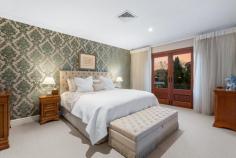  21A Duncraig Rd Applecross WA 6153 Positioned on one of the most prestigious streets within Applecross, this lock and leave home has been designed with a timeless architectural style and has been extensively renovated with exquisite quality and designer finishes to create a timeless home ready to move in and enjoy. Enter via secure electronic gates and be welcomed through the grand provincial wooden doors into this stunning residence. Cleverly designed and completed with quality, the home features polished timber floorboards, high ceilings, wrought iron balustrading and stone bench tops. The layout provides a spacious open plan kitchen, living and dining area on the ground level which has been recently renovated with wow factor. The kitchen includes island bench with breakfast bar, pendant lighting, stone bench tops and quality appliances. The adjoining living room has a stone gas fireplace, timber floorboards and overlooks the outdoor area. There is also an additional lounge room with fireplace, separate formal dining/theatre, powder room and separate laundry on this level. There is also a large alfresco area complete with fan that overlooks the glistening swimming pool. Upstairs comprises three double bedrooms all with built in robes and a grand master suite that features adjoining sitting room/library/nursery, his and hers wardrobe and luxurious bathroom ensuite which has been updated with free standing bath, double vanity and the most up to date finishings. The grounds are surrounded by established gardens though are easy care and reticulated. Whilst designed with a timeless style, this home has the latest in modern conveniences including ducted reverse cycle air conditioning, security alarm and an abundance of storage. There is a double lock up garage and generous store room/workshop/wine cellar. This location is within 10 minutes easy walking distance to the very best features within this riverside suburb. Stroll to the popular Applecross Village café strip, riverfront foreshore, Heathcote parklands, Yacht Club, Tennis Club and Primary School. 