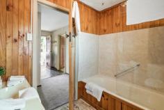  4 Torpy Avenue SNUG TAS 7054 $625,000 - $675,000 Positioned on a large and level 1407m2 block and a leisurely stroll to exquisite esplanade views or the lapping shores of Snug Beach, this 1950’s family home is just waiting for you to unleash the impressive potential on offer. There is much more here than meets the eye so let’s take a look inside. At a generous 161sqm the existing floor plan incorporates a large kitchen, which firmly anchors separate and spacious living areas. A sweet and cosy sunroom is the perfect spot to sip your morning coffee, or step to outdoor living, ideal for gathering with guests as you host celebrations in your new home. Two generously proportioned bedrooms and a bathroom also grace the layout, and outdoors a garden shed and two carports provide vehicle accommodation and storage. Discover existing fruit trees and more on this huge allotment, and the gardener in your family will be able to implement the glorious garden design they have always dreamed of. Presenting versatile options for remodelling and refurbishment, the possibilities are endless with how to embrace this unique offering. Renovate to create your own family sanctuary. Showcase original features, such as the open fireplace, timber doors and architraves to enhance the existing character. Or blend carefully curated improvements to create a showcase of contemporary style. The choice is yours. This is a location to love. Meander alongside the river, or head to the beach for your morning walk. This exceptional location provides the ultimate in convenience too. Walk to local shopping, bus and Snug Primary School, and you’ll find all that is on offer in this beautiful part of the Channel area within easy reach. So don’t hesitate, with only a handful of properties currently on the market in delightful and desirable Snug, this home won’t last long. Call today to arrange your private inspection. • 1950’s family home with enticing potential in fabulous Snug location • 161sqm of living on a large and level 1407m2 block • Ideal for renovation or remodelling • Walk to bus, local shopping and Snug Primary 