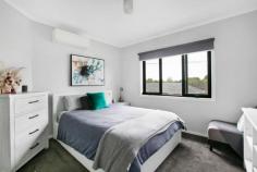  171 Boldrewood Parade Reservoir VIC 3073 Nestled in a prized location footsteps from Broadway Village, a dream lock-and-leave lifestyle is yours to own with the incredible purchase of this two-storey townhouse, which delivers all the space you'll need on a manageable scale. Its position is also within walking distance to parklands, local buses and Ruthven train station, local shopping hubs, La Trobe University just 7 minutes away and plenty of additional amenities. The practical floor-plan showcases a ground floor open plan living and dining zone with sliding doors accessing a pergola courtyard garden perfect for indoor/outdoor en-tertaining. The immaculate kitchen includes stainless steel appliances and plentiful storage. Up-stairs houses a two-bedroom sleeping wing with stylish bathroom and home office with retreat. Additional attributes also include plush carpets, split system heating/cooling, floating timber floors plus a single garage with low maintenance garden surrounds. 