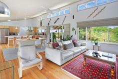  429 MOUNTAIN VIEW ROAD MALENY QLD 4552 $1,380,000 This stylish and much-loved home is perfectly positioned and designed to capture one of the absolute best views of the Glasshouse Mountains and beyond. The current owners have created an enviable space with a neutral palette that allows the view and very pretty block to shine. Views are on offer from every room and the deck has been extended and elevated to include a large sundeck; you'll feel on top of the world as you step out. Delighted family and friends will love to gather with you in your Hinterland home; the open kitchen, dining and lounge area is the heart of home and leads out to the timber decks and entertaining space. With three bedrooms, the master offers a lovely en suite with twin sinks and double shower heads in the extra long shower. The second bedroom has its own en suite and would be ideal for guests, teenagers or dual living. Just off the master bedroom is a sunroom that would be the perfect study, dressing room or exercise space. With its very pretty block, excellent floorplan for guests and those views, this home offers so much potential for accommodation for the wedding and tourist market. Just a 4-minute drive away is the bustling township of Maleny and all its amenities; primary and secondary schools, medical centres, hospital and of course its celebrated cafes, restaurants and shopping. • Panoramic views to the Glasshouse Mountains, the Sunshine Coast and Brisbane City • Deck extending the length of the home with an elevated sundeck • Stylish and modern open plan kitchen, dining and lounge • Cook friendly kitchen with substantial storage, an island bench, workspace and a walk-in pantry • Gas cooktop, electric oven and dishwasher • Master with access to the deck, a large walk-in robe and en suite with twin sinks and double shower heads • Sunroom off the master perfect for a dressing room • High raked ceilings • Fireplace and air conditioning in the living area and master • Fans throughout • Tasmanian Oak flooring throughout • Large windows and high louvered windows to capture the breeze, view and light • Laundry perfectly tucked away off the kitchen for easy access • Resident birdlife; Magpies, Butcher Birds, King Parrots, Rosellas, and Lorikeets • Fully fenced 4016 sqm2 block • Thoughtful plantings to create privacy, established gardens and lawn • Solar power and solar hot water • 2 car remote garage and workshop • 2 x 22,500L tanks • Parking space for the caravan, boat or trailer Such a delightful piece of property, iconic location, a stylish home and incredible views must be inspected today. 