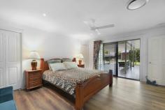  30 Cornwall Drive Elanora QLD 4221 This spacious family home is set in an elevated position on 1.46 acres of pristine land, just 10 minutes from the golden sands of Currumbin Beach. If acreage near to the ocean is your idea of the perfect lifestyle, this home could be a dream come true. As you rise, you'll love enjoying your morning coffee from the elevated position of your bay windows overlooking the gently sloping front lawn dotted with kangaroos and wallabies, before letting your gaze rise to enjoy the treeline of surrounding bush areas. When the kids arrive home in the afternoon you'll welcome the layout of this home, with the kitchen overlooking a sparkling mineral pool, vast undercover alfresco area and fully fenced house block with separate area beyond for chickens or other hobby farm desires. The blend of modern and traditional on this property provides the most versatile lifestyle opportunities. The home is largely powered by solar and has smart home capabilities like zoned temperature control, an integrated sound system, and lightning fast NBN. However, when you're ready to unplug there is ample space and infrastructure to sink your hands into the earth of a thriving vegetable garden, tend to your animals, enjoy the massage jets of the pool, or simply curl up by the wood burning fire place for cozy winter evenings. The improvements that are less glamorous but essential to create a high standard of living have been completed by current owners who are driven by quality and attention to detail. This includes things like installing outstanding storm water drainage, roof renovations, repositioning power poles to outside the fence line, installing quality full coverage fencing, a state of the art waste water management system and so much more. The result is a home of outstanding quality ready for you to move in as is, make aesthetic updates, or even bring your own renovation to life with a quality foundation to work from. The main family home features an updated kitchen with stone bench tops and an induction cooktop, four spacious bedrooms, two bathrooms, and two light-filled living areas each with a beautiful outlook. An additional one bedroom unit with bathroom and kitchenette is separated from the main home by an enclosed breezeway. This space is ideal for dual-living, a private home office, wellness space, or teenage retreat. The opportunities are endless in a property of this calibre set on stunning acreage in a central location between the beach and the Hinterland, with all the amenities of city life accessible in just a few minutes drive. FEATURES - MAIN HOUSE Set in an elevated position with a beautiful outlook Four bedrooms, three bathrooms, two living areas one with wood burning fireplace Huge undercover alfresco area with doors opening onto the kitchen/dining area and master suite Over-sized master retreat with walk in wardrobe, ensuite with double vanity, and separate spa room Three other good sized bedrooms all with built-ins Main bathroom with separate toilet Hybrid floating flooring to living areas, slate tiles to kitchen and hallway Zoned, ducted reverse cycle temperature control with temperature sensors managed by central tablet or your smart phone Wired for Dolby Atmos surround sound system with ceiling speakers Internal laundry with linen cupboards 2 x Solarhart systems providing solar power and hot water Separate double garage with additional carport FEATURES - LAND 5905m2 fully fenced rectangular block suitable for families who love pets like dogs, horses, chickens and more Town water plus 5000L rainwater tank Mineral or salt pool with multi-option spa jets Taylex tank with Envirocycle water treatment system servicing all three bathrooms Stormwater drainage to street gutter system FEATURES - 1 BEDROOM UNIT Separated from main home by an enclosed breezeway Has its own separate access One bedroom with compact ensuite and views over front lawn to nearby treeline Kitchenette with cupboard space and sink adjoins dining/living area overlooking pool and alfresco area Plumbed in for washing machine LOCATION Elanora High School - approx 8 minutes Elanora State School - approx 9 minutes The Pines Shopping Centre - approx 9 mins Currumbin Beach - approx 10 mins Gold Coast International Airport - approx 17 mins Burleigh Heads - approx 18 mins 