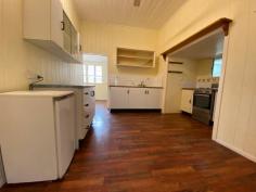  9 Dougall Street Bororen QLD 4678 This property is set in the hub of Bororen set on a 1012m2 block of land which is fully fenced. The property does front the Bruce Hwy only approx 30mins to Tannum Sands and Boyne Island . Walk to Bororen primary school and school bus pick up to either Tannum Sands or Miriam Vale HIgh school. * Simple cottage style home with front timber deck * Fully fenced yard surrounded with well established trees * Two bay zincalume shed with a workshop area * Functional kitchen with stainless steel oven * Separate lounge room with ceiling fan * Separate dining room * Main bedroom with walk in wardrobe and ceiling fan * Second carpeted bedroom * Bathroom with shower over bath and toilet * 9' high ceilings * Currently tenanted. Weather you are looking to live in your self or wanting an investment for the future. 