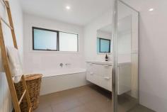  2/5 Clarendon Street Frankston VIC 3199 $670,000 - $737,000 Sparing no expense over two storeys with quality fixtures and finishes and a focus on easy living, this superbly appointed three-bedroom contemporary townhouse delivers carefree comfort in the beating heart of beachside Frankston. Flooded in radiant natural light, spacious interconnected living and dining flows out through glass doors to a private courtyard garden, while an impressive cook's kitchen delights with a waterfall-edge stone breakfast peninsula, gas cooktop, stainless-steel oven, integrated dishwasher and smoky mirrored splashback. Plush carpeting and day-and-night roller blinds adorn all three bedrooms, which are served by a contemporary master ensuite on the lower level and a full modern bathroom upstairs with a bathtub, shower, floating vanity and separate toilet. A study nook with built-in desk, high ceilings with LED lighting, ceramic tiling in the living room and wet areas, fresh tones, ducted heating and a single garage are among the inclusions of this turnkey residence, which will suit starters, investors, couples and families equally. A walkable distance to the train station, beach, Bayside Shopping Centre, restaurants, cinemas, the hospital, Homemaker Centre, Monash University, Chisholm and Frankston Primary School in the Frankston High School zone, this property also ticks every single box for savvy investors. 