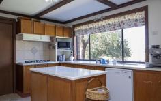  606 Dripstone Rd Dripstone NSW 2820 $975,000 A slice of old England in Dripstone This beautiful Tudor style home located in the undulating hills of Dripstone, set on a 2.6-hectare or roughly 6.4-acre property. The property's location in the hills of Dripstone offers a serene and peaceful environment, allowing you to escape the hustle and bustle of town. The large property size provides ample space for outdoor activities, such as gardening or hosting outdoor events. The Tudor style of the home adds to its charm, providing a unique and distinctive look that sets it apart from other homes. The downstairs area of the home boasts four spacious reception rooms, including a theatre room, formal lounge, sitting room, and a large dining room. The theatre room features cathedral ceilings, adding to its grandeur and providing an excellent space for entertaining guests or relaxing with family. The sitting room opens out to a tiled outdoor area, creating an ideal space for outdoor dining or relaxing in the fresh air. The outdoor area is perfect for entertaining guests, especially during the warmer months. This home also features an office, located just as you walk in, providing a private and quiet workspace that is separate from the rest of the living areas. This is an excellent feature for those who work from home, providing a dedicated space to focus and be productive. The views of the garden will add to your workday. The kitchen has been beautifully crafted from timber and features an island bench with ample storage, a convenient pull-out pantry, and a breakfast bar. The kitchen is equipped with a stove top and oven, both powered by LPG gas, providing an efficient and reliable cooking experience, it’s design and features make it a highly functional and convenient space, providing plenty of storage and bench space for meal preparation and cooking. The Ye Old touch and timber raked ceilings add character and a unique style to the home, making it stand out from other properties. This charming room opens out onto a delightful outdoor area, perfect for enjoying a morning coffee or outdoor dining. The laundry is very functional and has a toilet which is perfect for when you are entertaining. Overall, the downstairs area of the home provides ample space for relaxation, entertainment, and work. The various reception rooms and outdoor area provide flexibility in how the space can be used, catering to the needs of different members of the family. The four bedrooms are all located upstairs. Each of the bedrooms has a built-in robe, providing ample storage space for clothing and personal belongings. The master bedroom has been recently renovated and features a large built-in robe and a fully renovated ensuite bathroom. The ensuite includes a rainwater shower, separate wash basins with a marble top, and plenty of storage space, adding a touch of luxury and convenience to the master suite. Bedroom 2 is particularly charming, with an ornate bay window overlooking the front yard, providing plenty of natural light and a beautiful view. All the bedrooms upstairs have fully ducted evaporative air cooling, which also helps to keep the downstairs area cool during the summer months. In addition, the downstairs area features split systems, providing additional cooling options for the warmer seasons. The main bathroom is located upstairs and is well-appointed, featuring a bath and a separate shower, providing flexibility for the family's bathing preferences. The bathroom also includes a vanity just outside the bathroom, providing a convenient space for grooming and getting ready for the day without interfering with those using the bathroom. This home is equipped with several eco-friendly features, which not only help reduce the carbon footprint of the property but also offer significant cost savings to the owners. The home has a solar hot water system installed, which utilizes renewable energy from the sun to heat the water for the property. In addition, the property has a 4.2 kW solar system with 15 kW storage, which generates electricity for the home and significantly reduces energy costs. The energy generated by the solar panels can be stored in the batteries for later use, providing a reliable and sustainable source of power. The property also benefits from minimal rates and no water costs, making it an attractive option for those looking to save on household expenses. Overall, the eco-friendly features of the property offer a sustainable and cost-effective living solution for the new owners, allowing them to enjoy a comfortable and environmentally conscious lifestyle. The property features three garages, including two two-car garages and a three-car garage with a hoist. More pictures available on request. The outside area has many beautiful lifestyle features – These include. o Bore for outside water and underground sprinklers. o 90,000 concrete water tank for house use o 30,000 poly tank as back up o Solar hot water o 4.2 KW solar system with 15 kw storage o Separate greenhouse o Established gardens including Pears, Oranges, Mandarins, Cumquat, Lemon, Fig, Chilli, and quince. o 2 x two-car garages and a three-car garage with hoist o Small Dam filled with yabbies o Alarm Systems on the garages o CCTV on the house o Electric gate opening 