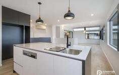  1/83 Athleen Avenue Lenah Valley Tas 7008 $795,000 Set in the superior suburb of Lenah Valley, this near new, architecturally designed, executive townhouse featuring designer glass aggregate blockwork will define a new standard in high-end property in Hobart. Townhouse 1 offers an extremely versatile floorplan catering for executive couples, small families, investors and retirees. The home comes complete with well planted native gardens, a stunning balcony for luxurious entertaining, panoramic views, double garage, extensive double glazing throughout, full insulation including under the ground floor concrete slab and small courtyard. Cleverly positioned to capture great sun, warmth and an amazing outlook the property showcases an impressive combination of intelligent design with quality modern finishes. From the entry foyer on ground level you have either internal access to the double garage or access to two good sized bedrooms featuring built in wardrobes and a unique family bathroom. The staircase upstairs leads directly to the social heart of the home, the spacious open plan and versatile living areas and kitchen. It is complimented by its sleek design and extremely contemporary appearances. The striking kitchen with premium acrylic solid surface bench tops, soft close drawers, push cupboards, offers Franke appliances including integrated dishwasher, induction cooktop and undershelf 700mm rangehood. This area of the home with sliding doors to the undercover terrace provides a modern and practical space for the entire family. Completing the homes accommodation is the master bedroom providing a full dressing room and dual access into the upstairs bathroom and powder room doubling as an ensuite. The bathroom here features programmable under tile heating, twin head showers and on trend swiss designed black fittings. Having been built with efficiency in mind, the townhouse was designed to minimise occupant maintenance with all year round green artificial grass in the courtyards, covered tiled terrace and well planted native gardens surrounding the home. The layout and window positioning ensures the fortunate purchaser will feel as though privacy is paramount. These breathtaking townhouses will epitomize luxury. You are purchasing a lifestyle of low-maintenance living. Located 5 minutes from the CBD and Salamanca, close to all schools, shops, cafes and restaurants of Lenah Valley connect to the convenience today. The quality is unsurpassed and the superiority can only be understood with a private tour of this home. If you are searching for a value for money property close to Hobart then you need to explore 83 Athleen Avenue, there is nothing comparable in greater Hobart. It provides a quality offering of timeless ambience and stylish living. You will not be disappointed, this is where all of your dreams come true. 