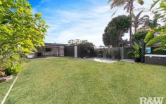  94 Priestman Ave Umina Beach NSW 2257 $1,100,000 - $1,175,000 After undergoing a major transformation, this immaculate single level home oozes quality and style. Well positioned in a quiet no thru street & only 1.5km to Umina Beach town centre & beaches. - Three bedrooms, built in robes in the main and second bedroom & all with ceiling fans - Stunning kitchen with 40mm stone benchtops, 900mm freestanding electric oven with gas cooktop & modern cabinetry - Spacious bathroom with a free standing bath, wall hung vanity, frameless shower screen and floor to ceiling tiling - Living & dining area with reverse cycle air-conditioning, recessed entertainment unit & floating flooring - Plantation shutters throughout - Internal fitted out laundry with external access - Large decking area at the side of the home leading to covered entertaining at the rear - Beautifully landscaped gardens & lawns with popup sprinkler irrigation system - Great privacy on a fully fenced block - Oversized singe garage for great storage - Other features include a private spa area, natural gas outlet in entertaining area for heating or cooking, instant natural gas hot water, LED downlighting throughout and square set cornices. 