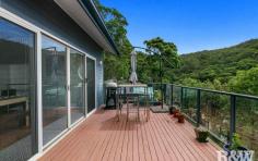  224 Glenrock Parade Koolewong NSW 2256 This amazing home is framed by natural beauty on all sides with a stunning Brisbane Water vista to the North and East and Brisbane Water National Park immediately at the rear boundary. It's beautifully designed and finished with high ceilings and the feeling of space all around. The home oozes charm and style with hardwood floors in the living and dining area. Whilst offering peace and tranquillity this home has unrivalled privacy. Its a practical home and offers versatility with self contained accommodation within the home on the ground floor. An important feature is the fact that it has excellent transport links with Koolewong railway station only 1km away and the M1 Motorway just 12km. • 4 bedrooms with ensuite & WIR to the main • 3 bathrooms & powder room • Fully self contained accommodation • Air conditioning • Twin decks • Double garage • Solar hot water 