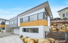 1/83 Athleen Avenue Lenah Valley Tas 7008 $795,000 Set in the superior suburb of Lenah Valley, this near new, architecturally designed, executive townhouse featuring designer glass aggregate blockwork will define a new standard in high-end property in Hobart. Townhouse 1 offers an extremely versatile floorplan catering for executive couples, small families, investors and retirees. The home comes complete with well planted native gardens, a stunning balcony for luxurious entertaining, panoramic views, double garage, extensive double glazing throughout, full insulation including under the ground floor concrete slab and small courtyard. Cleverly positioned to capture great sun, warmth and an amazing outlook the property showcases an impressive combination of intelligent design with quality modern finishes. From the entry foyer on ground level you have either internal access to the double garage or access to two good sized bedrooms featuring built in wardrobes and a unique family bathroom. The staircase upstairs leads directly to the social heart of the home, the spacious open plan and versatile living areas and kitchen. It is complimented by its sleek design and extremely contemporary appearances. The striking kitchen with premium acrylic solid surface bench tops, soft close drawers, push cupboards, offers Franke appliances including integrated dishwasher, induction cooktop and undershelf 700mm rangehood. This area of the home with sliding doors to the undercover terrace provides a modern and practical space for the entire family. Completing the homes accommodation is the master bedroom providing a full dressing room and dual access into the upstairs bathroom and powder room doubling as an ensuite. The bathroom here features programmable under tile heating, twin head showers and on trend swiss designed black fittings. Having been built with efficiency in mind, the townhouse was designed to minimise occupant maintenance with all year round green artificial grass in the courtyards, covered tiled terrace and well planted native gardens surrounding the home. The layout and window positioning ensures the fortunate purchaser will feel as though privacy is paramount. These breathtaking townhouses will epitomize luxury. You are purchasing a lifestyle of low-maintenance living. Located 5 minutes from the CBD and Salamanca, close to all schools, shops, cafes and restaurants of Lenah Valley connect to the convenience today. The quality is unsurpassed and the superiority can only be understood with a private tour of this home. If you are searching for a value for money property close to Hobart then you need to explore 83 Athleen Avenue, there is nothing comparable in greater Hobart. It provides a quality offering of timeless ambience and stylish living. You will not be disappointed, this is where all of your dreams come true. 
