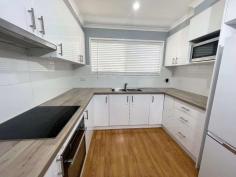  2/17 Doongara Street Griffith NSW 2680 $315,000 Looking for a modern 2-bedroom unit? Look no further! This open plan unit is located in a well-maintained strata complex of just 4 units, providing privacy and peace of mind. Built from brick, this unit boasts a modern bathroom, 2 toilets, and an updated kitchen with sleek finishes. The flooring throughout has also been updated to provide a contemporary feel. The unit features two large bedrooms, each with built-in cupboards, providing ample storage space. With plenty of natural light, this unit is perfect for those seeking a comfort and an open living space. The property also includes a closed in alfresco area and a private courtyard The complex itself is well maintained, and the unit comes with a designated car space. Conveniently located close to public transport, shops, and schools, this unit is the perfect choice for those seeking a low maintenance lifestyle or the perfect investment property. Don't miss out on this fantastic opportunity to secure a modern and stylish 2-bedroom unit within a small and friendly strata complex. 