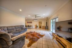  8 Terka St Innisfail Estate QLD 4860 $550,000 This impeccable house boasts a solid cement rendering and occupies a premium location on a fully fenced 800 m2 plot of land. The property comprises four bedrooms, fully tiled flooring throughout, ample built-in cupboards, air conditioning in all spaces, security screens, a second bathroom in addition to an ensuite bathroom, and a generously sized timber kitchen. You'll relish the vast undercover area at the back, leading to a capacious 3-bay shed. Tick the boxes. Close to transport: Close to Shops: Close to School: Close to Parks: Close to the Beach: Close to the CBD: 