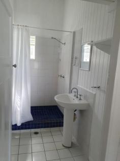  2 Breen St East Innisfail QLD 4860 $269,500 2 bedroom cottage in the Queenslander style that has just undergone renovations, situated on a corner with two street entrances. This house is ready to move into; if you want the charm of a Queenslander but only want a small space to maintain, this is the one. Features: * Polished timber floors * High ceilings and tongue and groove walls * A combination of louvers and casement windows, some with fly screens. * 2 Bedrooms, with a box air conditioner in the master bedroom * Ceiling fans throughout. * 1 Bathroom with a separate toilet * A brand-new upright stove in a modern kitchen * New curtains throughout * Single lock-up garage. With an upgraded roof. * The main roof is approximately 10 years old. * Pathways leading to the garage and a paved front yard * Laundry downstairs * Small lot in a flood free zone —only 506 square meters. * New 125 litre electric hot water system * R4 ceiling insulation has just been installed - making the house very cool inside. The exterior of the cottage walls have been sanded and repainted, and all the casement windows have been taken out, sanded, and re-fixed with all new screws. The utmost care has been taken during the renovation stage to retain original features of the cottage. Interior walls and ceilings have been freshly painted with mould and fungal resistant paint, making them bright and white. The yard has a cool feeling thanks to the mature trees that surround the house and let filtered light shine through. A recent professional pest inspection has reported that there were NO active pests detected, and for further peace of mind a termite perimeter treatment was completed in May 2023. This cottage is clean and tidy and walk in ready. 