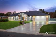 52 Loch Ness Cct New Beith QLD 4124 $1,250,000 This immaculately presented lowset home sits gracefully on an elevated 2002m2 block in a tranquil pocket of New Beith. Surrounded by premium new builds in a welcoming community, this beauty epitomises modern living with a seamless blend of indoor and outdoor spaces. Prepare to be captivated as you step into the inviting foyer with its impressive 3-metre-high ceiling. Enjoy the luxury of 3 separate living areas, including a formal lounge that sets the stage for effortless entertaining. The open-plan family and dining precinct offers a grand space that seamlessly connects to the stunning outdoor area. And for added convenience, a spacious activities/kids retreat awaits in the left wing, perfectly complementing the 3 bedrooms in that section of the home. The stunning gourmet kitchen is designed to impress and boasts expansive Caesarstone benchtops, a premium 900mm gas cooktop and integrated electric oven. The sleek 2-pak cabinetry features soft-close drawers with magnetic child-locks, ensuring both style and safety. With the dishwasher seamlessly integrated into the cabinetry and a convenient butler's pantry, this kitchen offers the perfect blend of form and function. To top it all off, a trio of pendant lights adds a touch of dramatic flair to this culinary haven. This stunner presents with 4 spacious bedrooms plus a study room, each featuring built in robes, air-conditioning, plush carpets and sleek plantation shutters, ensuring a touch of elegance in every corner. The master suite is a private sanctuary located in its own separate wing for ultimate privacy. It showcases a large walk-in robe and a luxurious ensuite. With dual stone vanities, a walk-in concealed shower and a toilet with a privacy door, this ensuite exudes opulence. The main bathroom is equally impressive, serving the remaining bedrooms with its stylish design. Step into the outdoor oasis and be amazed by the covered alfresco space that awaits you. With the addition of LED lighting, state of the art built-in ceiling speakers and a ceiling fan, this space exudes a perfect blend of comfort and sophistication. Feast your eyes on the expansive and level, low maintenance grassed backyard, providing ample space for outdoor activities. The front yard is equally as impressive with immaculately groomed grass that adds to the overall appeal. As you explore the backyard, you will discover a large, powered, 12m x 7m shed with full epoxy flooring. With 4 floodlights illuminating the entire backyard, this shed offers endless possibilities for storage, workshops and any other hobbies you may have. A home of this calibre is worthy of your inspection as the beauty within needs to be seen to be fully appreciated and there are simply too many outstanding features to list. Situated close to schools, shops, cafes, restaurants, transport, and access to major arterials, you will be impressed at every level. Immerse yourself in luxury living on a premium acreage block, amongst other quality builds and inspect this magnificent home now as it will not last long in the market. Property features and inclusions: - Nestled on a 2002m2 block in New Beith - House is just over 3 years old - Built by G&P Homes - Spanning approx 307m2 under roof - 4 bedrooms, all with BIR's, aircon & plantation shutters - Master boasts WIR and ensuite - Contemporary family bathroom - Guest powder room - 3 separate living areas: - Formal lounge upon entry - Open plan family & dining room - Activities/kid's/teenager's retreat - Study with built in robe - Gourmet kitchen featuring: - Expansive Caesarstone benchtops - Stunning 2-pak cabinetry - 900mm gas cooktop & integrated oven - Concealed dishwasher - Butler's pantry - Soft close drawers with magnetic child locks - Separate internal laundry - Ducted air-conditioning throughout - Premium tiling in main living areas - High ceilings - Tinted windows - Plantation shutters - Plethora of linen/storage cupboards - Huge walk-in linen closet - CCTV system - Video doorbell - Yamaha music cast system with built in speakers throughout - Security screens - Gas hot water system - Alfresco space with LED lighting, fan and speakers - 7m x 12m shed - 3-phase power, high clearance and epoxy flooring - Full concrete driveway + 6m x 3m concrete slab for additional parking - Floodlights x 4 - Double remote garage - 13.26 kW solar power - Mains water supply - 17,000 L rainwater tank - Low-maintenance gardens - Full irrigation system to front and sides of home - Fully fenced flat block - Side access (to both sides) - NBN – Fibre to the Premises - Council rates approx $780/qtr inc water - Current rental appraisal $750/qtr 