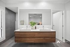  52 Loch Ness Cct New Beith QLD 4124 $1,250,000 This immaculately presented lowset home sits gracefully on an elevated 2002m2 block in a tranquil pocket of New Beith. Surrounded by premium new builds in a welcoming community, this beauty epitomises modern living with a seamless blend of indoor and outdoor spaces. Prepare to be captivated as you step into the inviting foyer with its impressive 3-metre-high ceiling. Enjoy the luxury of 3 separate living areas, including a formal lounge that sets the stage for effortless entertaining. The open-plan family and dining precinct offers a grand space that seamlessly connects to the stunning outdoor area. And for added convenience, a spacious activities/kids retreat awaits in the left wing, perfectly complementing the 3 bedrooms in that section of the home. The stunning gourmet kitchen is designed to impress and boasts expansive Caesarstone benchtops, a premium 900mm gas cooktop and integrated electric oven. The sleek 2-pak cabinetry features soft-close drawers with magnetic child-locks, ensuring both style and safety. With the dishwasher seamlessly integrated into the cabinetry and a convenient butler's pantry, this kitchen offers the perfect blend of form and function. To top it all off, a trio of pendant lights adds a touch of dramatic flair to this culinary haven. This stunner presents with 4 spacious bedrooms plus a study room, each featuring built in robes, air-conditioning, plush carpets and sleek plantation shutters, ensuring a touch of elegance in every corner. The master suite is a private sanctuary located in its own separate wing for ultimate privacy. It showcases a large walk-in robe and a luxurious ensuite. With dual stone vanities, a walk-in concealed shower and a toilet with a privacy door, this ensuite exudes opulence. The main bathroom is equally impressive, serving the remaining bedrooms with its stylish design. Step into the outdoor oasis and be amazed by the covered alfresco space that awaits you. With the addition of LED lighting, state of the art built-in ceiling speakers and a ceiling fan, this space exudes a perfect blend of comfort and sophistication. Feast your eyes on the expansive and level, low maintenance grassed backyard, providing ample space for outdoor activities. The front yard is equally as impressive with immaculately groomed grass that adds to the overall appeal. As you explore the backyard, you will discover a large, powered, 12m x 7m shed with full epoxy flooring. With 4 floodlights illuminating the entire backyard, this shed offers endless possibilities for storage, workshops and any other hobbies you may have. A home of this calibre is worthy of your inspection as the beauty within needs to be seen to be fully appreciated and there are simply too many outstanding features to list. Situated close to schools, shops, cafes, restaurants, transport, and access to major arterials, you will be impressed at every level. Immerse yourself in luxury living on a premium acreage block, amongst other quality builds and inspect this magnificent home now as it will not last long in the market. Property features and inclusions: - Nestled on a 2002m2 block in New Beith - House is just over 3 years old - Built by G&P Homes - Spanning approx 307m2 under roof - 4 bedrooms, all with BIR's, aircon & plantation shutters - Master boasts WIR and ensuite - Contemporary family bathroom - Guest powder room - 3 separate living areas: - Formal lounge upon entry - Open plan family & dining room - Activities/kid's/teenager's retreat - Study with built in robe - Gourmet kitchen featuring: - Expansive Caesarstone benchtops - Stunning 2-pak cabinetry - 900mm gas cooktop & integrated oven - Concealed dishwasher - Butler's pantry - Soft close drawers with magnetic child locks - Separate internal laundry - Ducted air-conditioning throughout - Premium tiling in main living areas - High ceilings - Tinted windows - Plantation shutters - Plethora of linen/storage cupboards - Huge walk-in linen closet - CCTV system - Video doorbell - Yamaha music cast system with built in speakers throughout - Security screens - Gas hot water system - Alfresco space with LED lighting, fan and speakers - 7m x 12m shed - 3-phase power, high clearance and epoxy flooring - Full concrete driveway + 6m x 3m concrete slab for additional parking - Floodlights x 4 - Double remote garage - 13.26 kW solar power - Mains water supply - 17,000 L rainwater tank - Low-maintenance gardens - Full irrigation system to front and sides of home - Fully fenced flat block - Side access (to both sides) - NBN – Fibre to the Premises - Council rates approx $780/qtr inc water - Current rental appraisal $750/qtr 